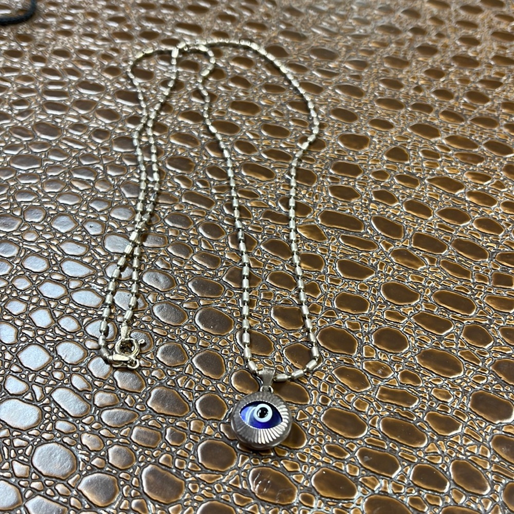 Silver eye necklace - does need to be cleaned